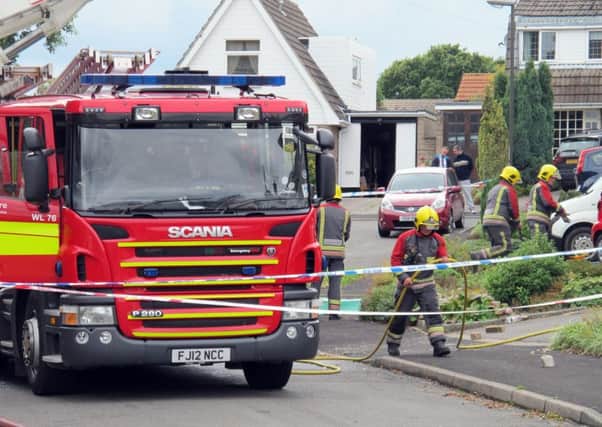 Fire crews at the house in Riddings, near Alfreton where two people died in a fierce house fire after a suspected gas blast. PRESS ASSOCIATION Photo. Picture date: Sunday September 20, 2015. See PA story FIRE Blast. Photo: Matthew Cooper/PA Wire
