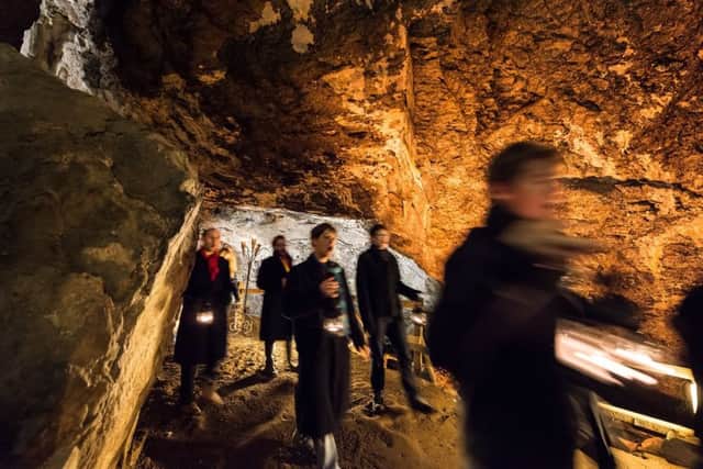 Albion choir perform underground at Peak Cavern, Castleton.