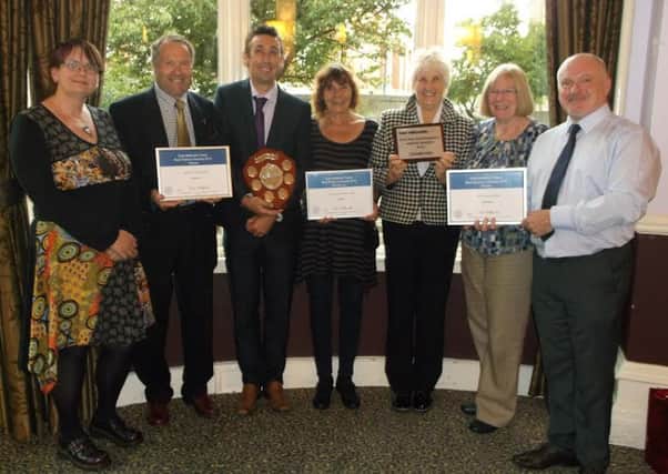 Representatives from Derwent Valley line stations show off their East Midlands Trains Best Station awards.