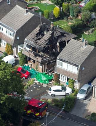 Aerial view of the scene on Valley View Road in Riddings, Derbyshire, where a house was destroyed in a gas explosion earlier today.  September 20,  2015.  Firefighters and an ambulance crew responded to a major gas explosion in a street in Derbyshire yesterday morning (Sun).  See NTI story NTIEXPLOSION.  Emergency services were waiting for structural engineers to determine if it was safe enough for them to tackle the blaze.  Derbyshire Fire and Rescue said they were called to an explosion in a property in Valley View Road, in Riddings, near Alfreton, Derbs at about 7.33am.  East Midlands Ambulance Service were also at the scene, supporting the firefighters.  Officers suspect there are people inside a damaged property on the street.