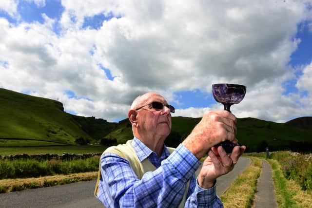 Peter Harrison from Treak Cliff Cavern examines a Blue John goblet, one of over 250 Blue John ornaments to be auctioned on October 5.