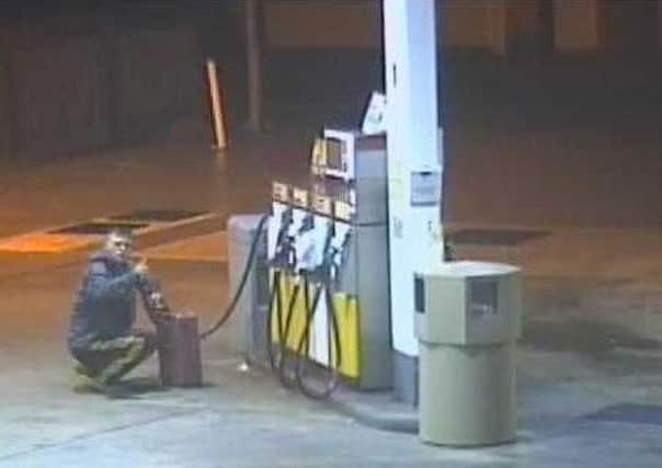 Pictured is a man at Meteor service station on Alfreton Road, South Normanton, whom police have urged to come forward after a fuel theft.