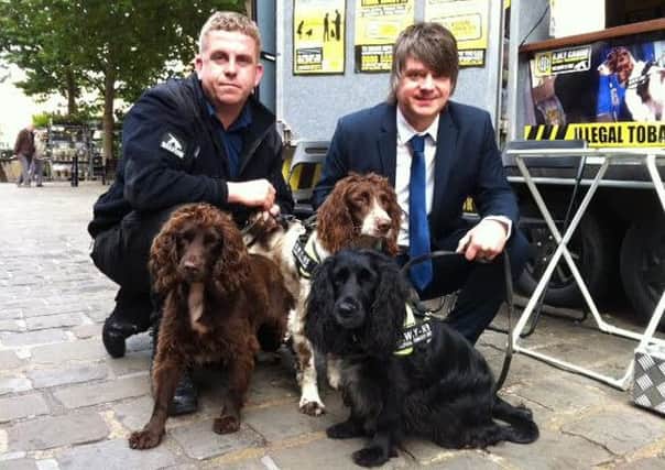 Pictured are dog handler Stuart Phillips, left, of BWY Canine, and trading standards officer Ade Barkin, of Derbyshire County Council, who hosted an illegal tobacco crackdown road show with sniffer dogs.