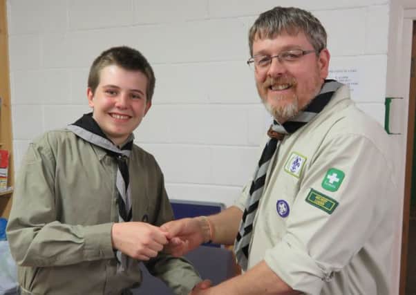 Jack Watts receives his Chief Scouts Gold Award from district representative Ian Almond.