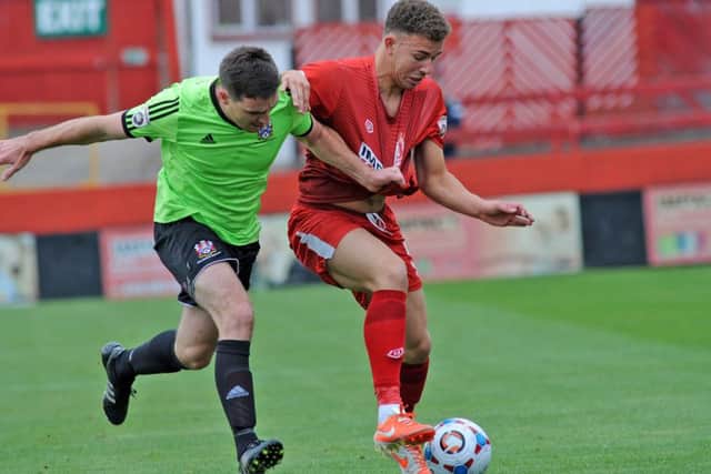 Alfreton Town v Stalybridge Celtic.
Keep your shirt on! Niall Heaton in action in the first half.