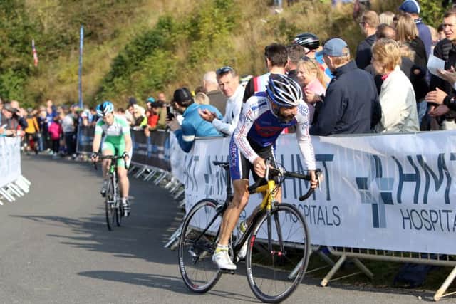 Chris Green of Matlock CC overtakes Sarah Gregson of Sport city on the final bit of the climb.