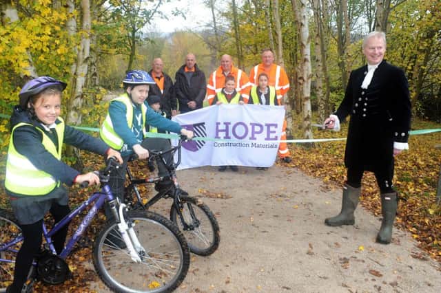 The High Sheriff of Derbyshire Oliver Stephenson cuts the ribbon to officially open the BMX Trail in Youlgrave on Friday.