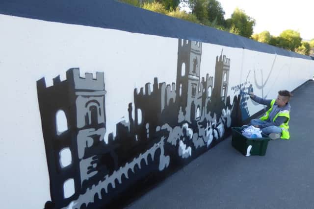 A painted mural depicting the distinctive features of Matlock has been unveiled on a wall in the town