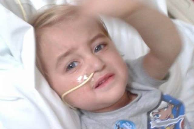 Morgan Gray, two, has an inoperable brain tumour. His family are now trying to raise money to take the Matlock youngster on holiday.