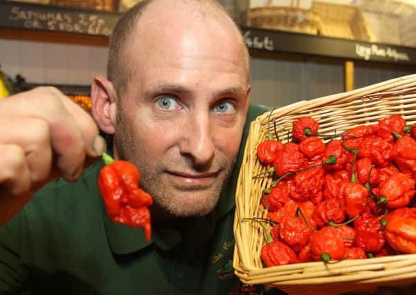Greengrocer Mathew Taylor with the world's hottest chilli