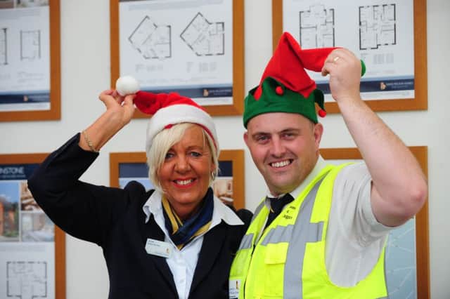 David Wilson Homes is welcoming people to donate to the Trussell Trust at its developments. Pictures: Sales Adviser Sheila Williams and Site Manager Craig Ison. for use in Hucknall Dispatch