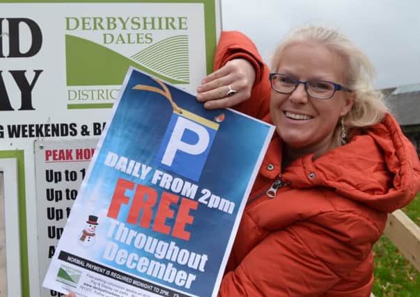 Derbyshire Dales District Council parks and streetscene officer Helen Carrington with one of the free parking posters that go up on 1 December.