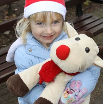 Matlock Christmas markets, four year old Alice Morley with her reindeer