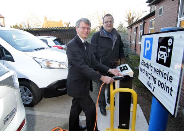 Mark Armstrong-Read (left) and Richard Lyne test a new charging point.