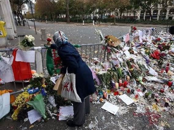 Floral tributes  left near the Bataclan concert hall in Paris following the terrorist attacks in November. Picture: Steve Parsons/PA Wire