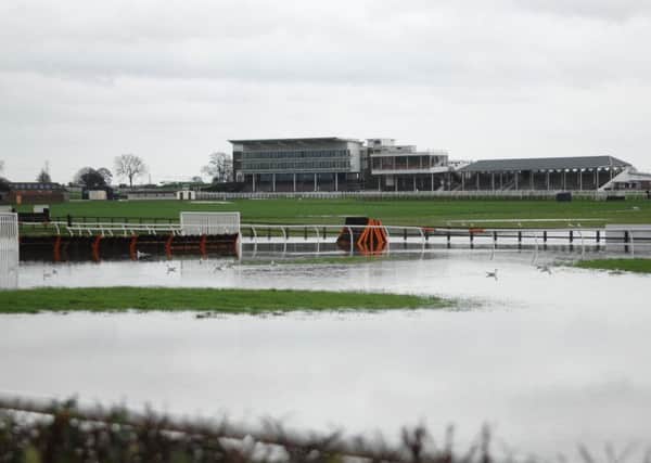 RAIN STOPPED PLAY -- a far cry from Cue Card's heroic victory in the King George at Kempton on Boxing Day was this scene at Wetherby where flooding sank the track's big Christmas meeting.