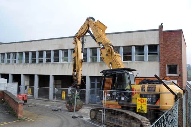 Heavy demolition machinery moves in on the old Derbyshire Times' buildings. Picture by Anne Shelley.