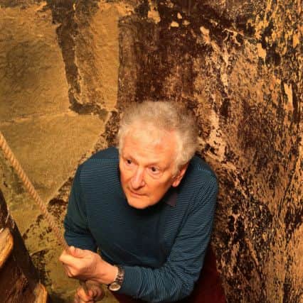 Peter Pitkin climbing the ancient staircase to the ringers room in the tower
