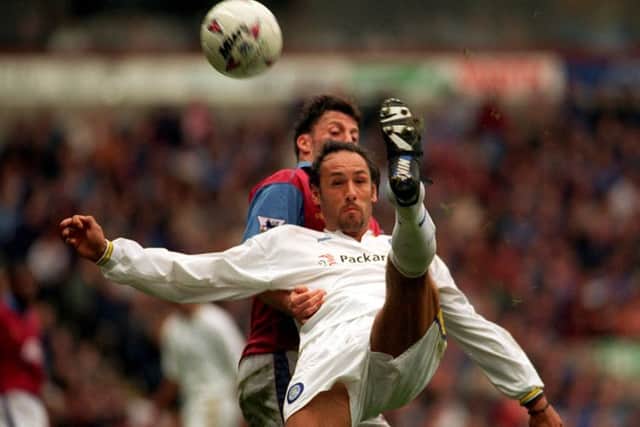 Leeds United's Mark Hateley blocks Villa's Andy Townsend and tries a backward kick into the box.