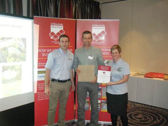 GWH1 Paving Services Director, Simon Wharton-Howett is pictured centre receiving his award from staff from Marshalls.  Pic provided for DT Biz page 04/02/16 by

Joanne Wharton-Howett
Secretary
Office: 01773 605372