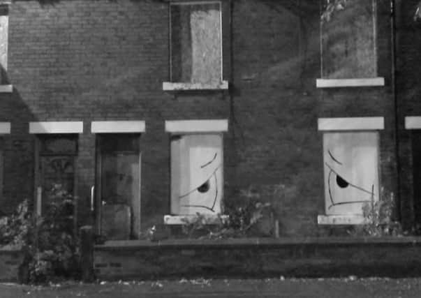 The Urban Badger installed artwork and a poem at this derelict house on Chatsworth Road, Chesterfield.