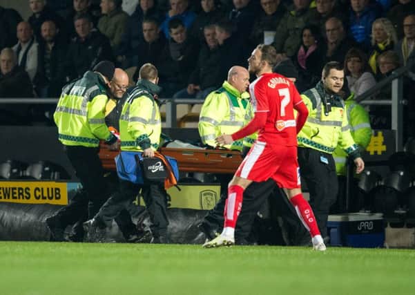 Burton Albion vs Chesterfield - Liam O'Neil leaves the game on a stretcher as his replacement Dan Gardner enters the field - Pic By James Williamson