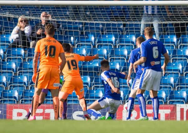 Chesterfield vs Colchester - Charlie Raglan scores an own goal in injury time giving Colchester a share of the points against the 10 men of Chesterfield - Pic By James Williamson