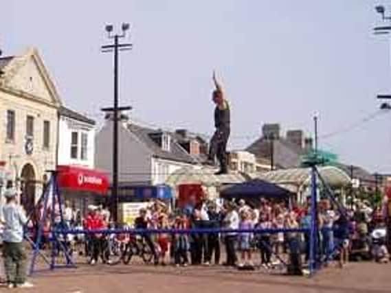 A circus performer is to take part in a campaign against jobseeker's rights in Shirebrook. (Pictured performing in Redcar market).