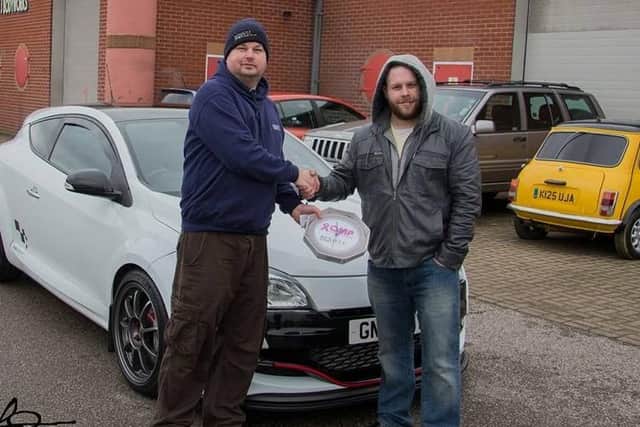 Dan Smart is a member of a Renault drivers' club - pictured with his Renault Megane as he receives a prize from one of Olivia's fundraisers.