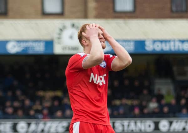 Southend United vs Chesterfield - Liam O'Neil holds his head in his hands after sending a chance over the bar - Pic By James Williamson