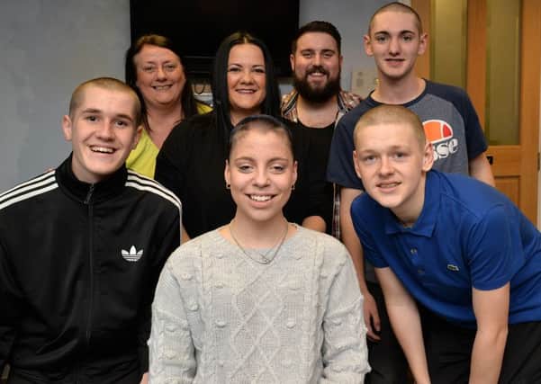 Four friends have had their heads shaved to raise money for Chesterfield Cancer Unit, pictured after the shave are Jamie Bullars, Chloe Blackband, Gareth Davis, Carter Widdowson and Luke Shorthose Manleys Barbers owner, Jane Walker and Kimberley Spizer