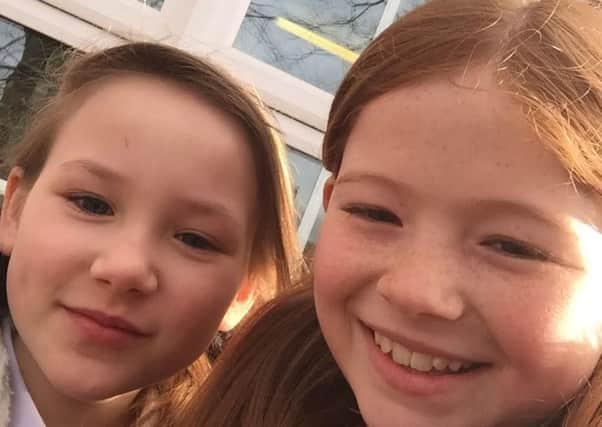 Elyse Platts, aged eight (left), with Olivia Stevens, also aged eight. The young girls will now be attending a Little Mix concert at Sheffield Arena after Elyse's mum Sam launched an online appeal to get Olivia a ticket.
