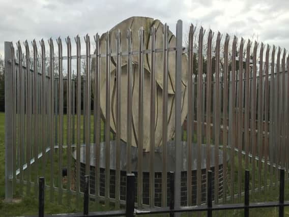 The Poise sculpture has been fenced off.