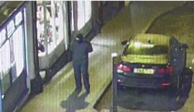Screenshot of police CCTV footage of thieves robbing a fish and chip shop in Derbyshire
