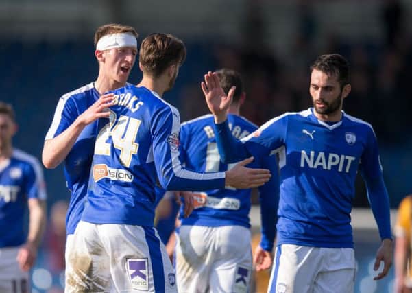 Chesterfield vs Port Vale - Tom Anderson Ollie Banks and Sam Hird celebrates a big 3 points at full time - Pic By James Williamson