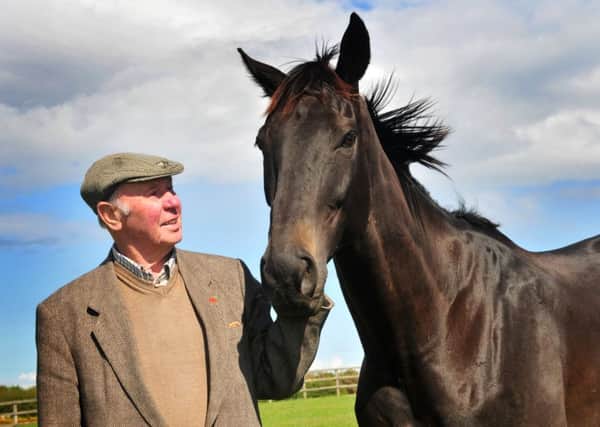 ONE MAN AND HIS HORSE -- owner Trevor Hemmings with Many Clouds, brilliant winner of last year's Grand National and the favourite for Saturday's race.