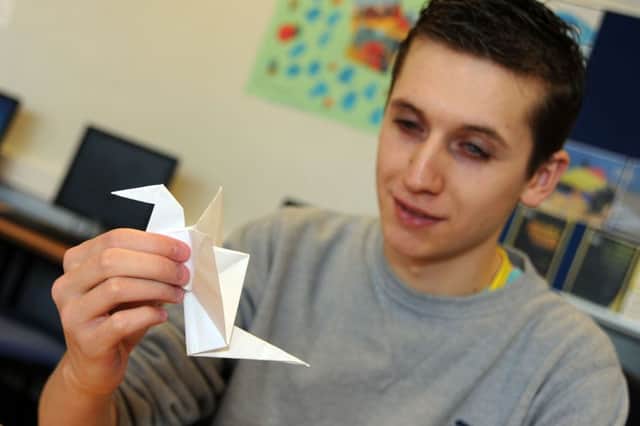 Vision West Notts College student, Declan Batten, who has impaired vision, but is an accomplished pianist, skilled artist and origami practitioner.
