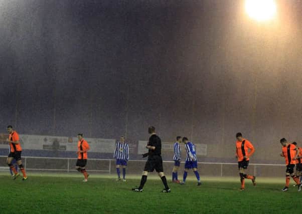 Staveley Miners Welfare v Worksop Town in the Toolstation Northern Counties East League. Heavy rain during the first half. Photo by Chris Etchells.