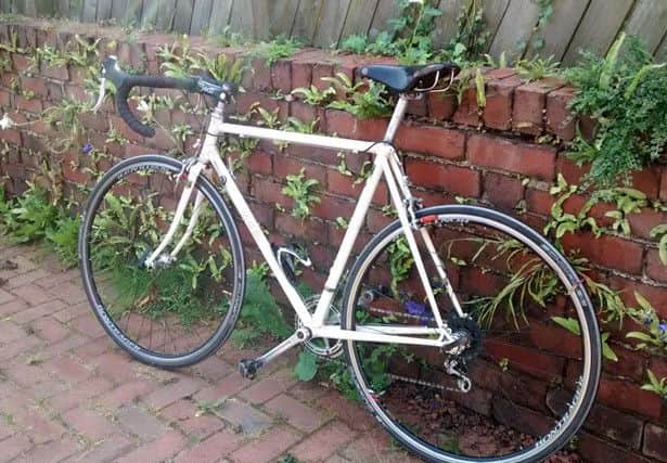 The cream coloured bicycle was hand built and is of sentimental value.