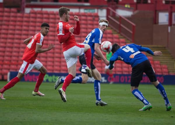 Barnsley vs Chesterfield - Sam Hird heads the ball away - Pic By James Williamson
