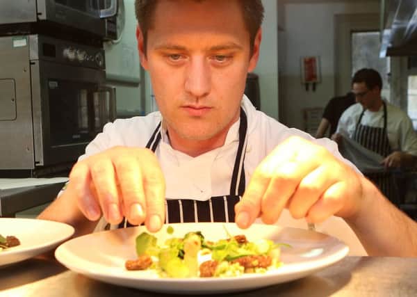Dan Smith head chef at the Peacock Hotel plates up the starter on his special foraging menu, poached pheasant egg with wild garlic, asparagus, morels and hazelnut