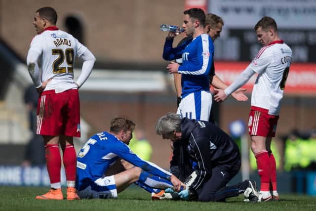 Chesterfield vs Sheffield United - Gary Liddle goes down with an ankle injury - Pic By James Williamson