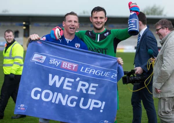 Tommy Lee and Ritchie Humphries celebrate League One Football next season