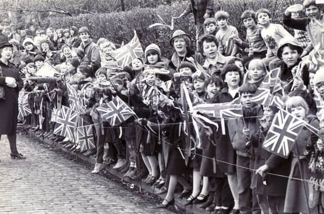 Queen Elizabeth II - visit to Derbyshire March 15th 1985
. Flag waving children cheer the Queen as she arrives at Matlock Railway Station