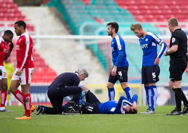 Swindon Town vs Chesterfield - Lee Novak goes down injured he rejoined the game but was replaced by Jamal Campbell-Ryce before half time - Pic By James Williamson