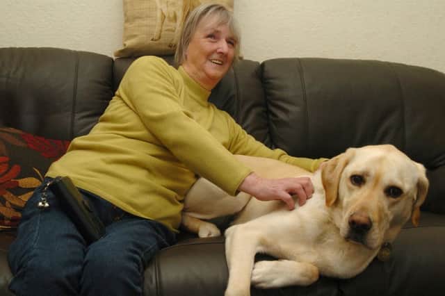 Liz Martin and her guide dog Pixie.