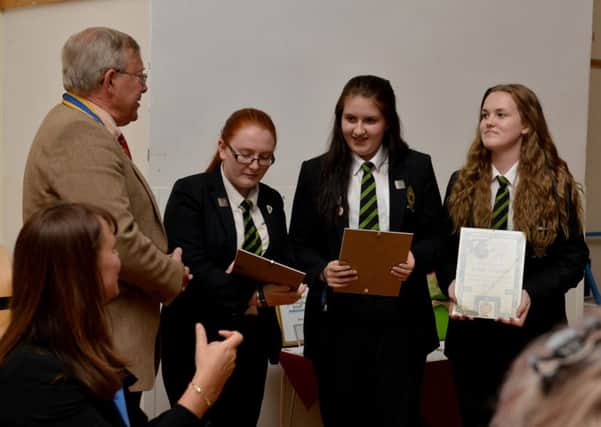 Awards presentation in recognition of the continued commitment and hard work in the community of students at Dronfield Henry Fanshawe School, students recieve an award from the Rotary Club