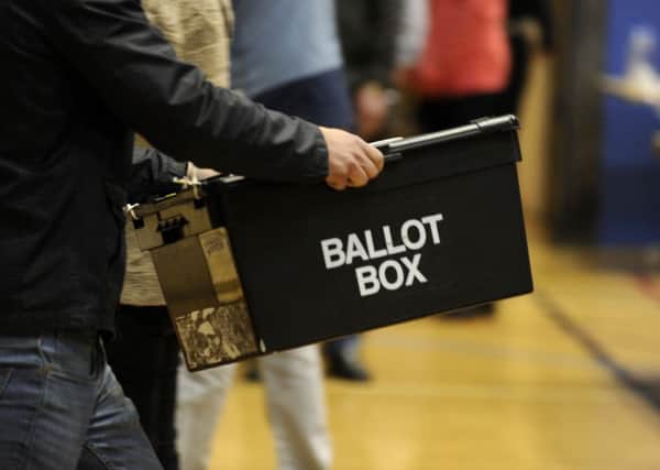 Ballot boxes are carried into the hall at the Richard Dunn Centre, Bradford,  for counting in the 2015 General Election.  7 May 2015.  Picture Bruce Rollinson
