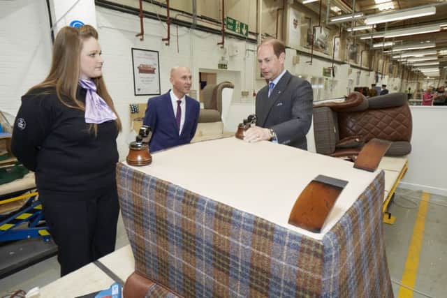 DFS Training Manager Wayne Butler and DFS apprentice Lia Rolfe observe HRH applying the feet to the final Diamond Chair.
