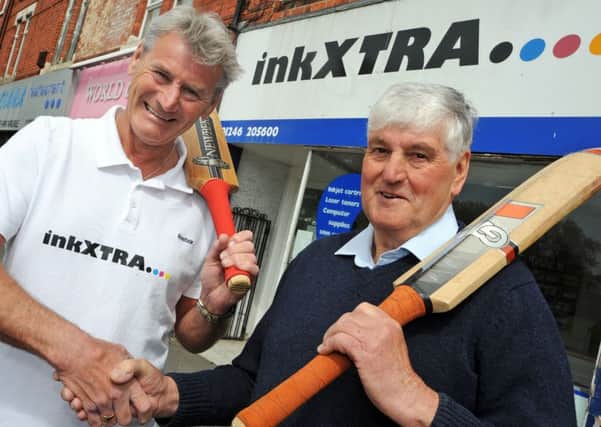 Andy Thomas-Horton, owner of inkXTRA and John Graney chairman of the Chesterfield Midweek League, shake hands on another year of sponsorship for the area's midweek cricketers.